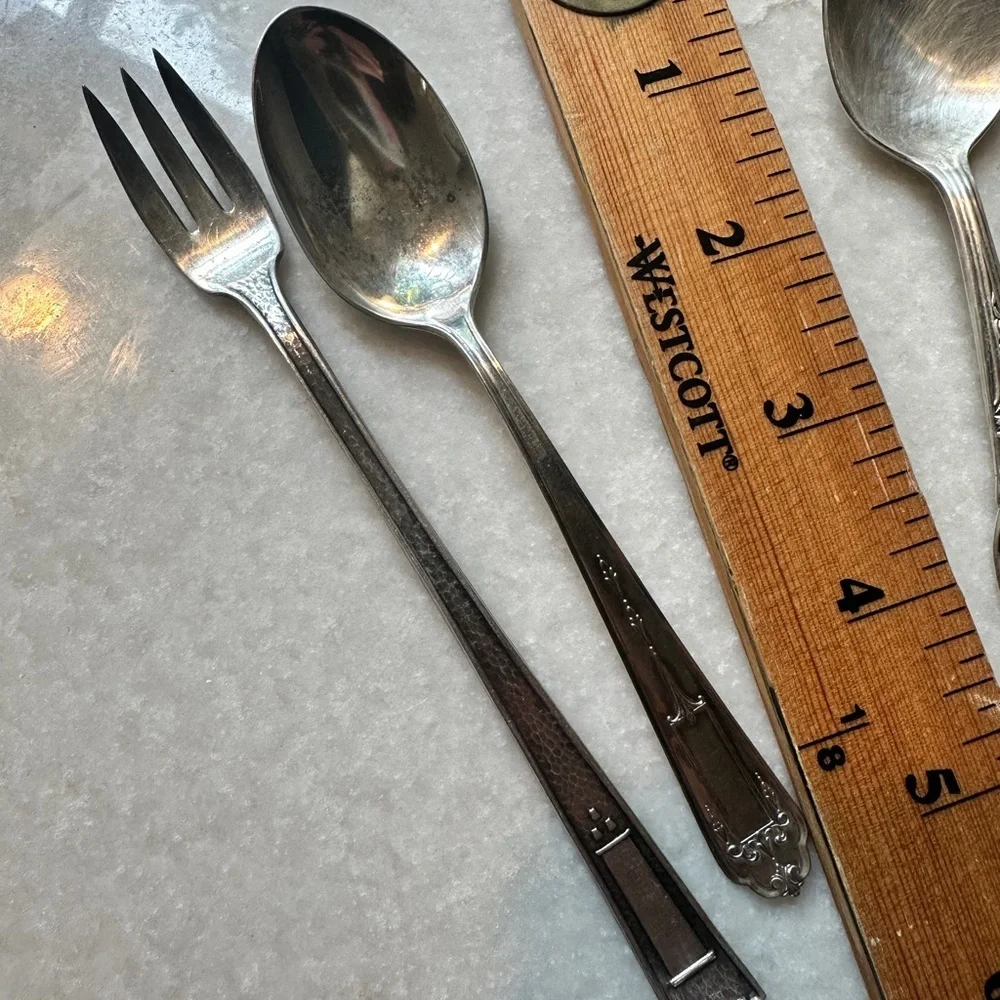 Small silverplate utensils.